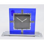 An Art Deco chrome and blue glass mantle timepiece, the square dial inscribed "Mappin",