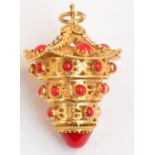 A large yellow metal filigree decorated and red coloured cabochon set pagoda pendant of stepped