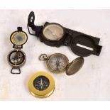 An American magnetic compass, dated 1966, two further American pocket compasses,