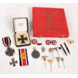 A group of German Third Reich predominantly period badges and other small items including two black