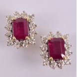 A pair of 9ct yellow gold diamond and ruby ear studs,