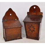 A late 19th century oak salt box with hinged fall lid and raised back with hanging hole with adzed