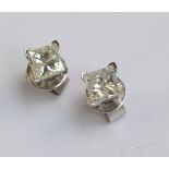 A pair of 18ct white gold and princess cut diamond ear studs, each diamond approx 0.