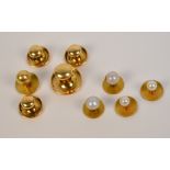 A pair of 18ct yellow gold and pearl dress studs, a similar yellow metal pair,