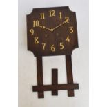 An early 20th century oak Arts and Crafts mission clock,