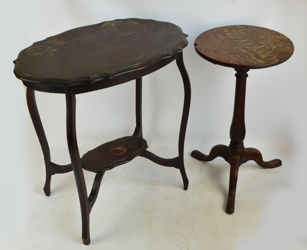 A late George III oak tripod table with circular top and three outswept supports and an occasional