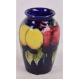 A small Moorcroft vase decorated in the Wisteria and Fruit pattern, impressed marks to base,