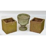 A pair of terracotta coloured textured square planters,