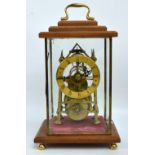 A late 19th century brass skeleton clock with thirty hour single fusee movement,