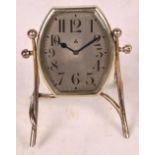 An Art Deco timepiece in silver plated easel frame,