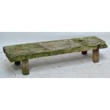 A low rustic wooden plank bench, length 145cm, height 29cm.