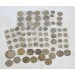 A collection of Japanese and Chinese silver coins including Japanese yen, Chinese sanuple,