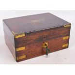 A 19th century rosewood and brass cornered travelling box with hinged lid enclosing gilt tooled