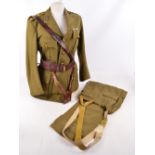 A Royal Artillery khaki jacket and trousers with leather shoulder strap and belt.