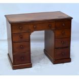 A mahogany pedestal desk with leather top,