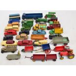A collection of vintage Dinky playworn vehicles including cars, trucks, buses, steamroller,
