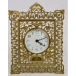 A late 19th century brass cased easel back timepiece,