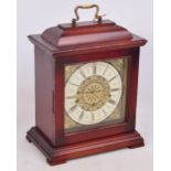 A modern West German stained mahogany triple chime bracket clock,