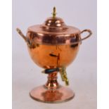 A copper twin handled tea urn with brass turned finial and tap, height 40.5cm.