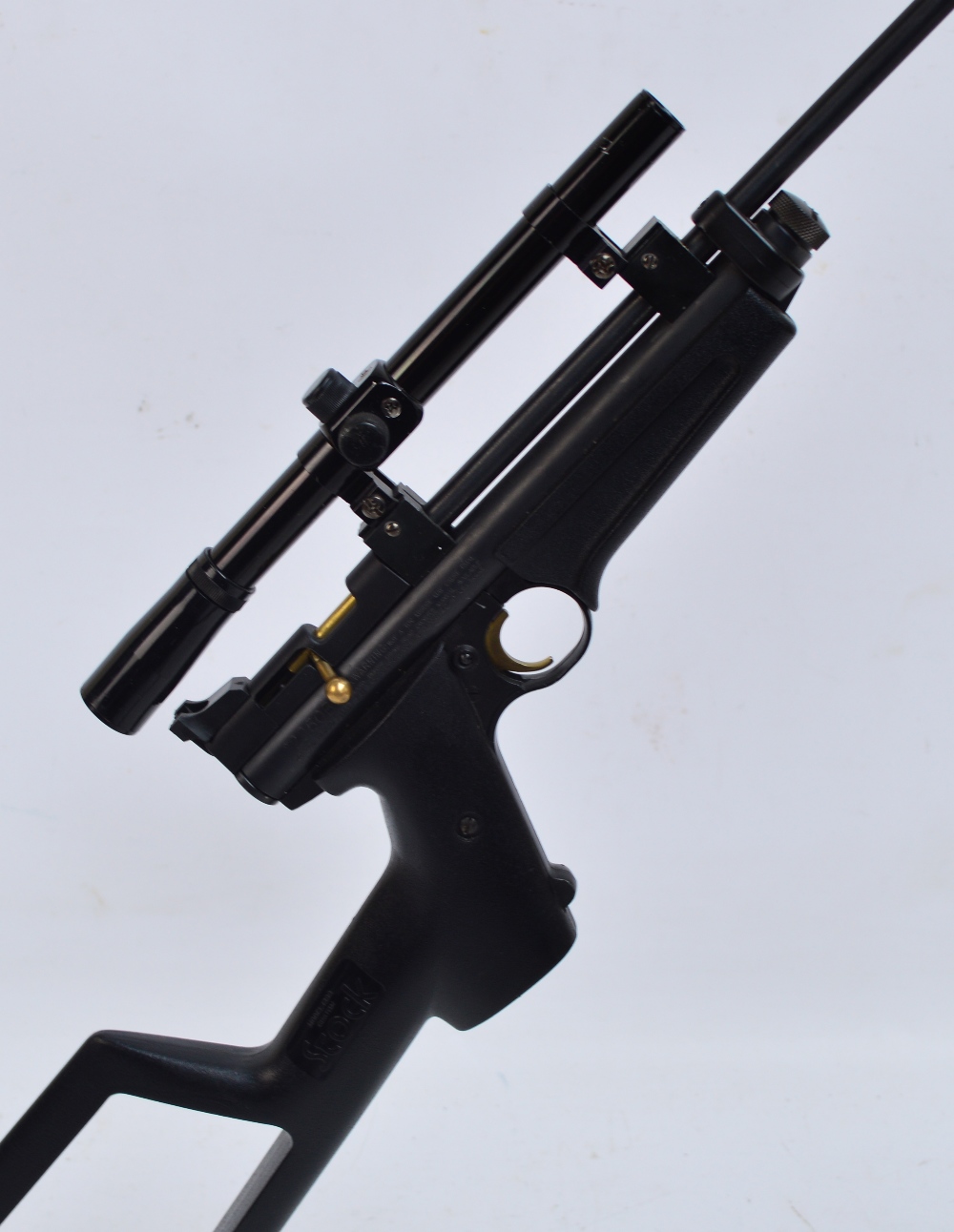 A Crossman "Ratcatcher" .22 pre charged air rifle with plastic skeleton stock and scope.