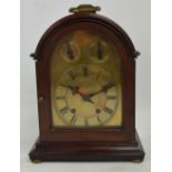 An early 20th century mahogany cased Winterhalder & Hofmeier eight day mantel clock with brass dial