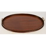 An Edwardian mahogany string inlaid oval tray with twin handles, length 62cm.