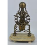 A late 19th century brass skeleton clock with Gothic architectural case,