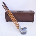 Four hickory shafted golf clubs with leather grips, three endorsed by Harry H Tuck,