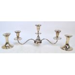 A pair of George V hallmarked silver candlesticks of waisted form,