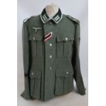 A copy German Third Reich Grossdeutschland combat tunic.