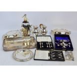 A quantity of plated items including two Guernsey milk jugs,