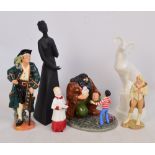 A collection of six various Royal Doulton figures;