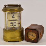 An early to mid 20th century brass ticket clock of cylindrical form, height 12.