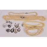 Five simulated strings of pearls, dress rings with matching earrings and pendant, also a brooch,