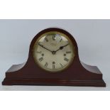 An Edwardian mahogany and chevron strung eight day mantel clock with circular silvered dial set