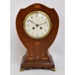 An Edwardian Art Nouveau oak, satinwood and mother of pearl inlaid mantel clock,