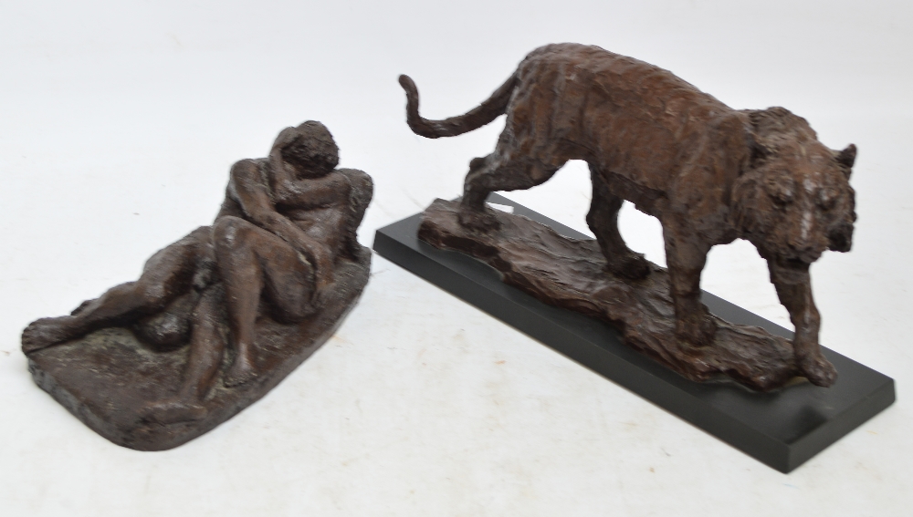 Two modern resin decorative figures; one depicting a walking tiger, bearing signature to base "W.