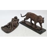 Two modern resin decorative figures; one depicting a walking tiger, bearing signature to base "W.