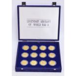 A set of twenty four 1991 brass Marshall Islands Legendary Aircraft of WWII coins,