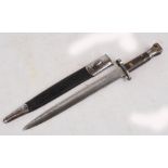 A 1888 pattern Lee Metford bayonet with leather scabbard, length 43.5cm.