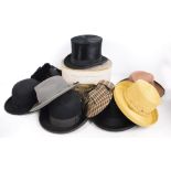 A collection of hats including a boxed top hat by Thomas Gillett of Hull with leather inner band,
