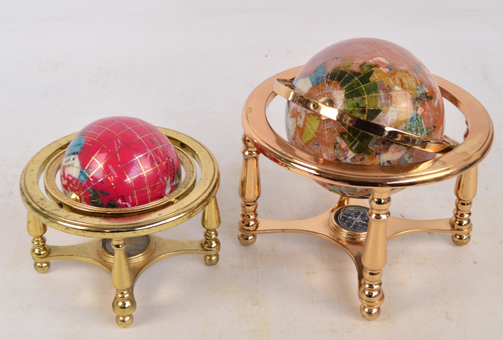 Two modern hardstone globes in brass gimballed frames, the larger height 21cm (2).