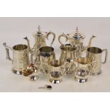 A four piece tea set of footed baluster form with bright cut decoration,