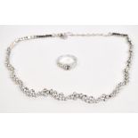 A Swarovski crystal necklace with free form linked sections, length 35cm, also a similar ring,