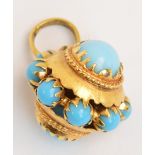 An 18ct yellow gold and pale blue cabochon set pendant, width approx 1.6cm.