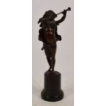 A 19th century bronze cherubic figure playing double flute,