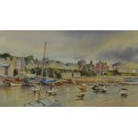 JOHN HOBSON NICHOLSON (British, 1911-1988); watercolour, a seashore village scene with boats,