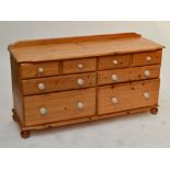 A pine chest of drawers with two formations of two short above two long drawers with crackle glazed