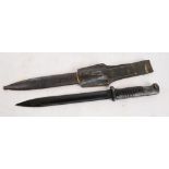 A German WWII bayonet, the blade numbered 8626, in metal scabbard with leather belt attachment,