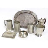 A collection of pewter items to include mugs of tapering forms,